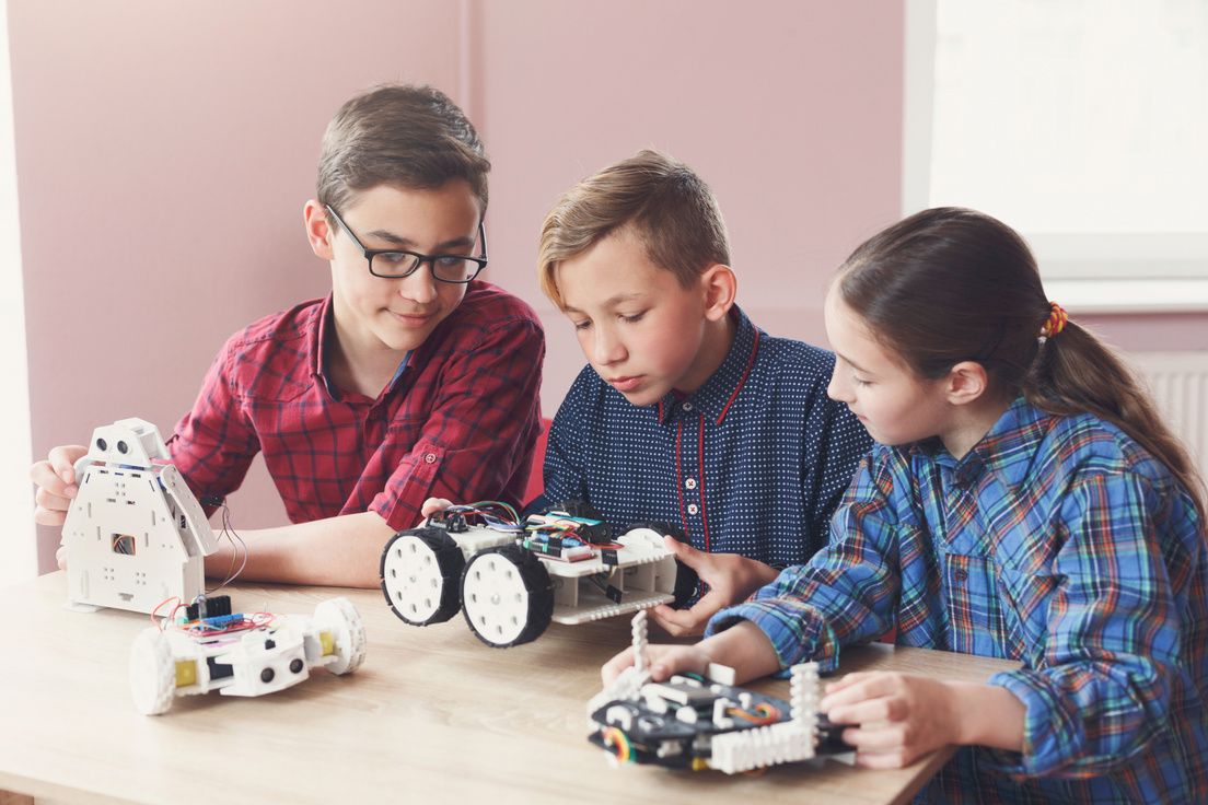 Stem education. Kids creating robots at school